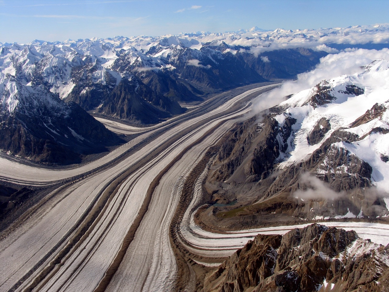 aerial view with mountains glaciers and a valley