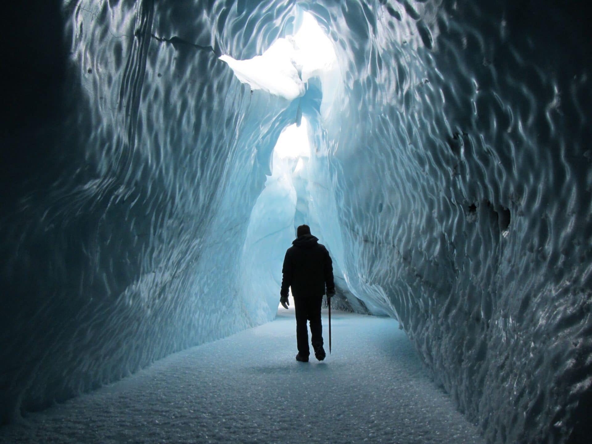 Person walking through an ice tunnel