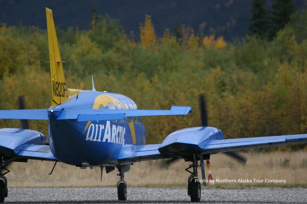 Small blue plane taking off