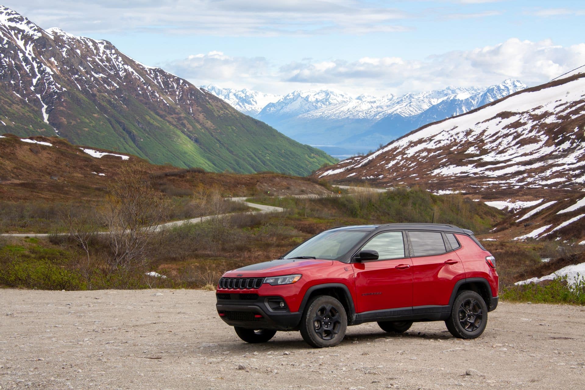 jeep compass infront of snowy mountains