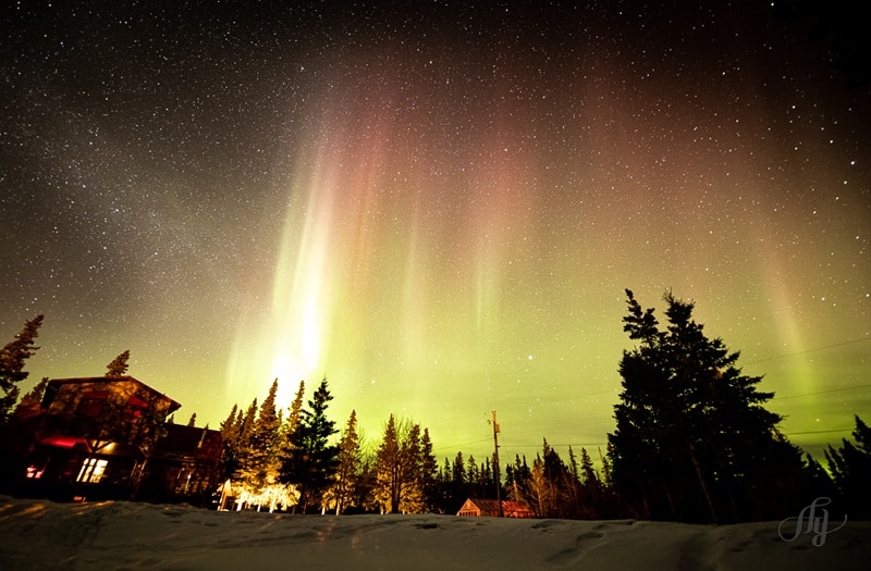 Mount Logan Lodge in winter with Aurora